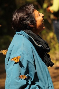 Woman with monarch butterflies