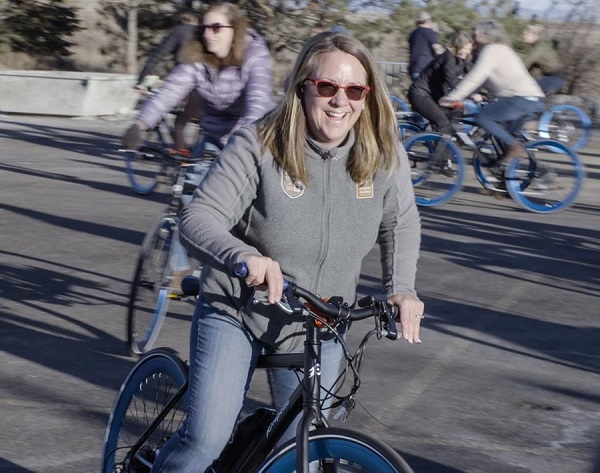 Shelby Campbell, Adventure Relations Director, riding her new electric bike