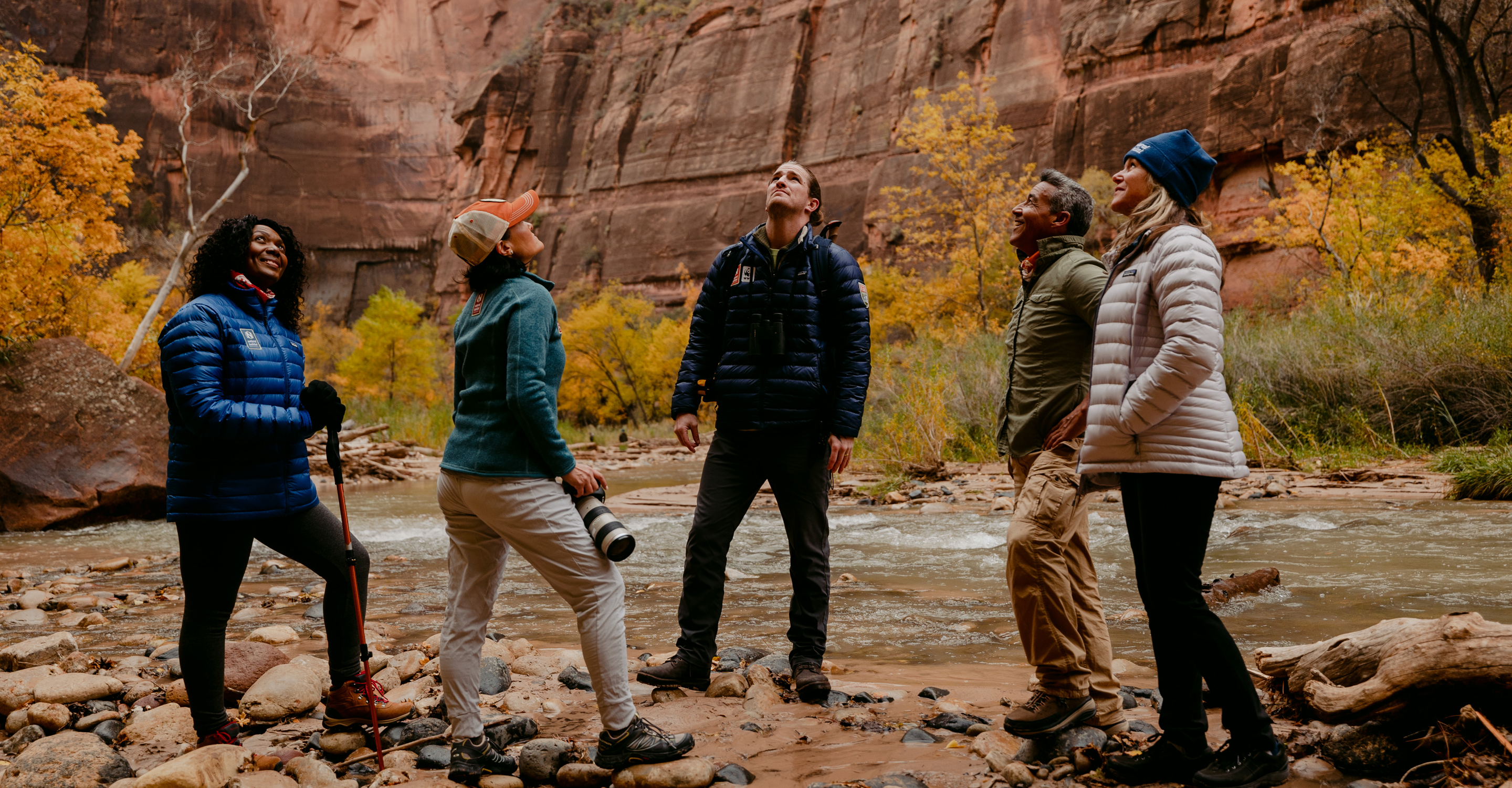 Guiding a group of travelers under the massive walls of Zion NP.